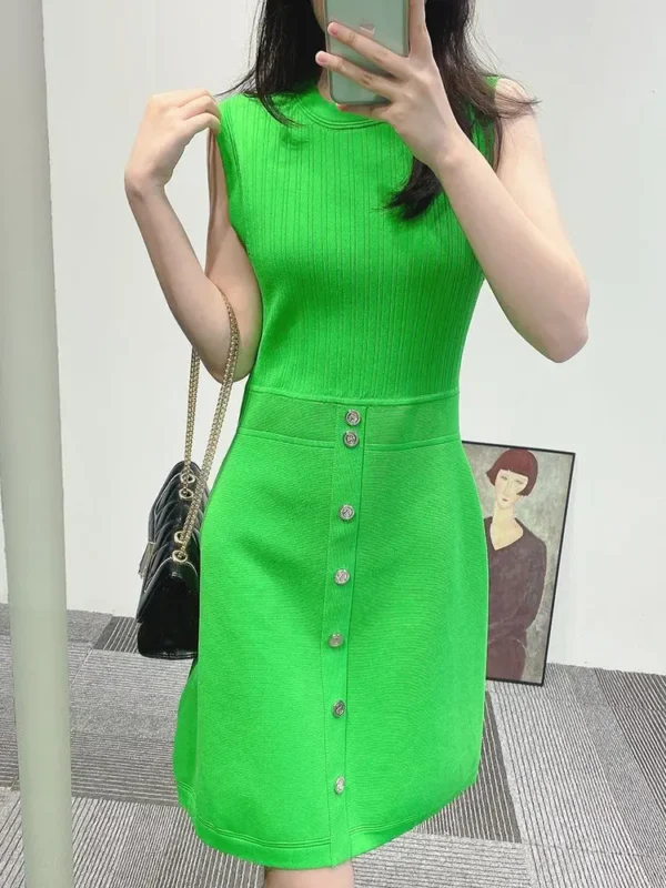 Green prom dress with sleeveless A-line, elastic waist, and metal buttons